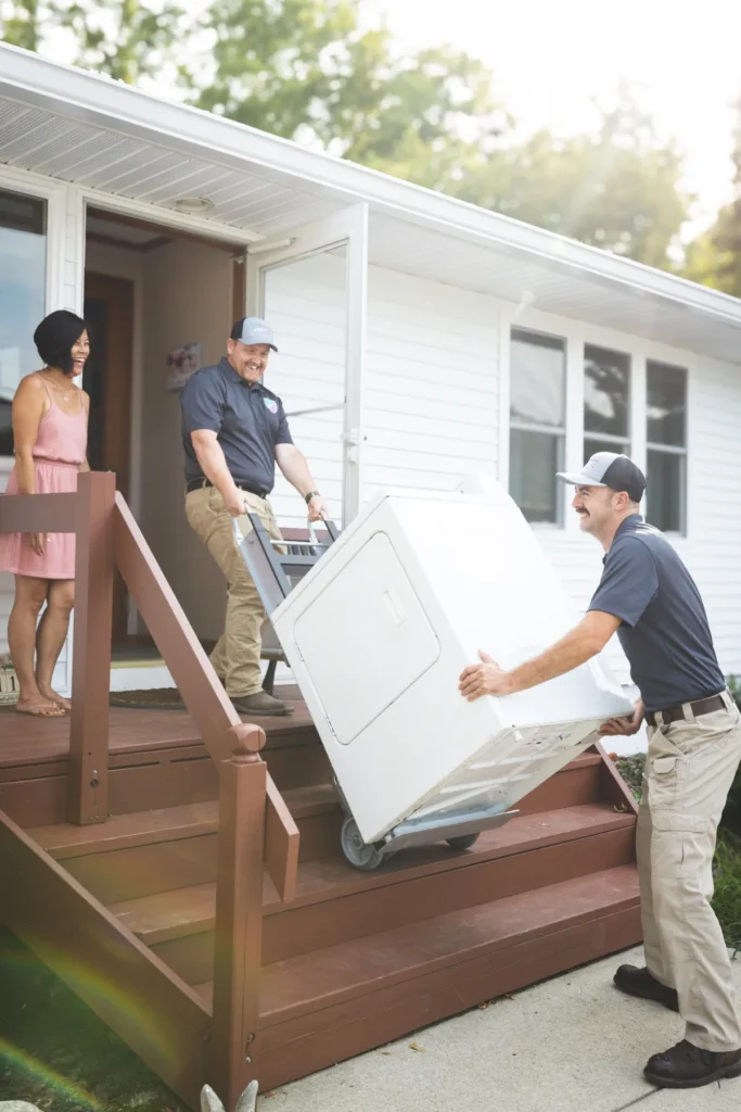 Crew delivering washer dryer